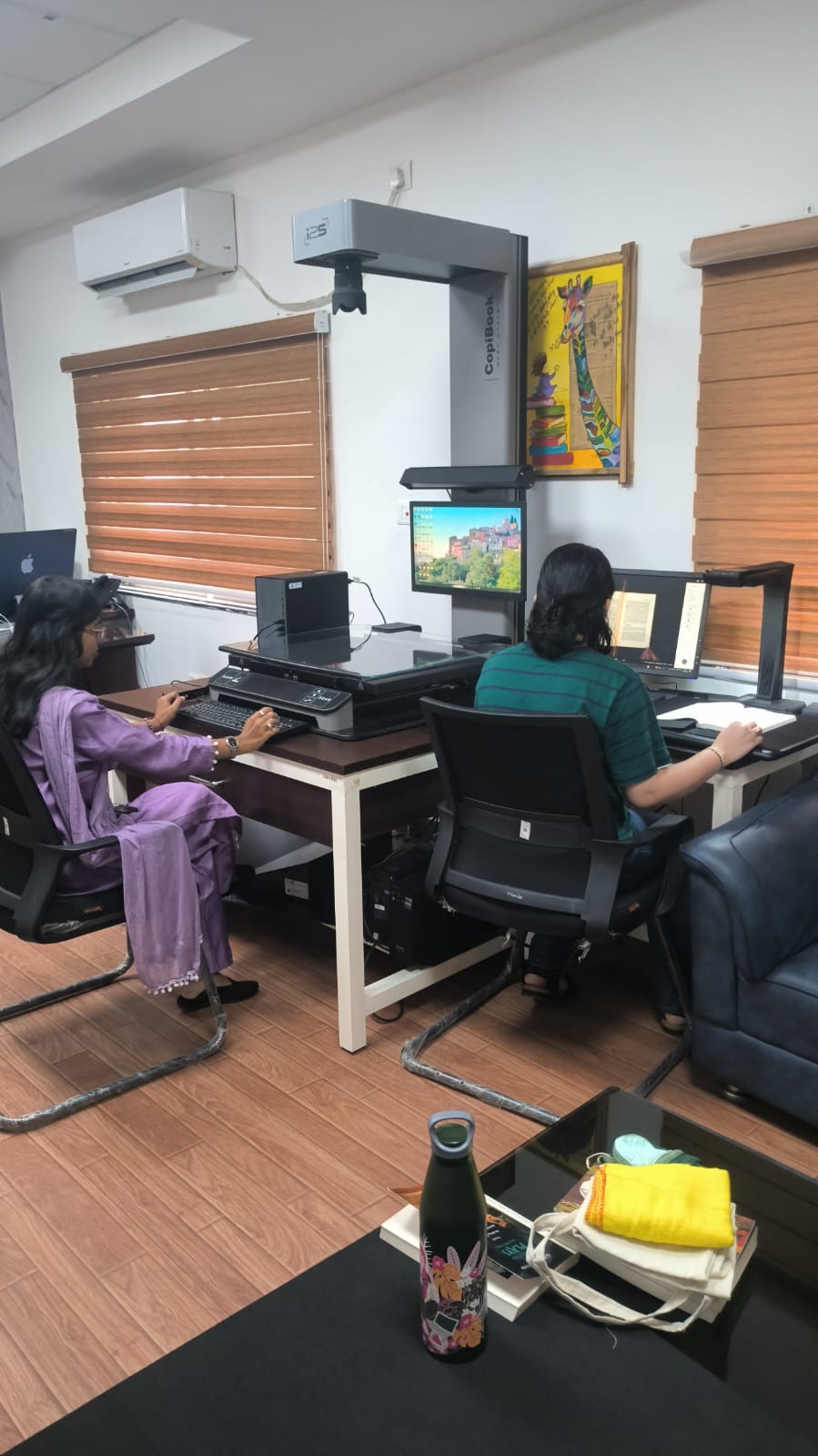 Students working at i2S CopiBook and imaging workstations in the Centre lab